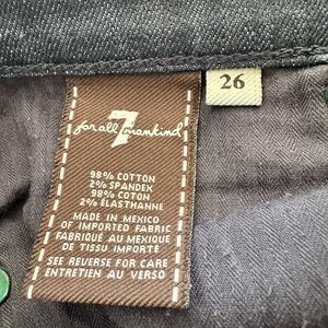 Dark wash, Slight stretch ankle length, lower rise jeans.